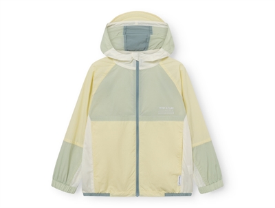 Mini A Ture Matmulti uv overgangsjakke i wheat yellow col. b. set forfra