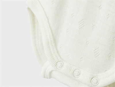 Detalje af Name It uld body i snow white med trykknapper