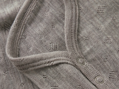 Detalje af Name It uld body i satellite med trykknapper