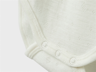 Detalje af Name It uld body i snow white med trykknapper