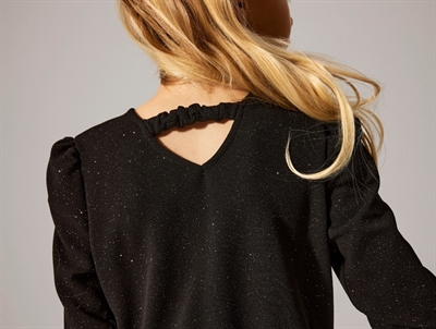 detalje af ryg med elastik og glimmer på Name It buksedragt