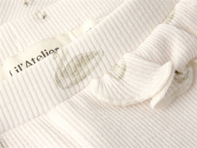 Lil\' Atelier BABY leggings i pastel parchment med svaneprint og flæser