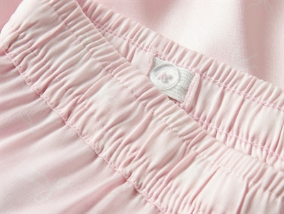 detalje af justerbar elastik i taljen på lyserøde bukser fra Name It