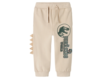 Name It Jurassic World sweatpants i råhvid nuance med dinosaurprint