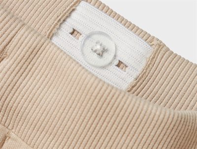 Name It Jurassic World sweatpants i råhvid nuance med dinosaurprint