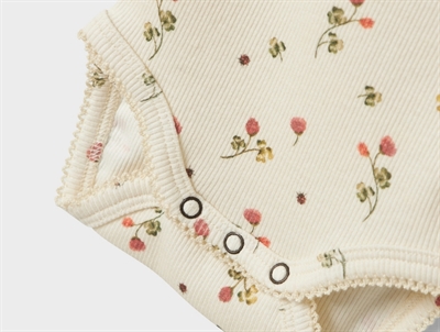 Lil\' Atelier body turtledove med blomsterprint og flæser