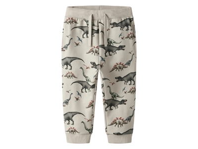 Name It sweatpants i lys beige nuance pumice stone med dinosaurprint