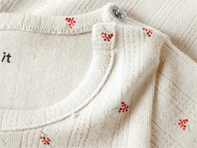 Name It body i beige nuance peyote melange med trykknapper ved skulder