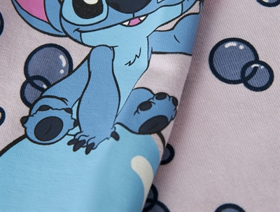 Detalje af Name It leggings med Stitch motiv og bobleprint
