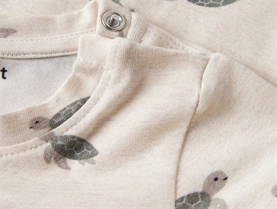 Name It body i beige nuance detalje med trykknapper og skildpadder