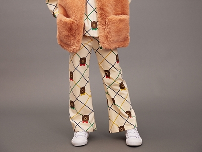 Barn med Mini Rodini flared bukser i råhvid med print