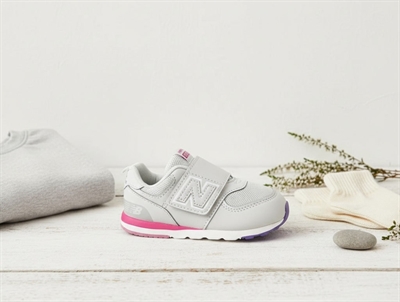 New Balance gray matter/signal pink 574 sneaker